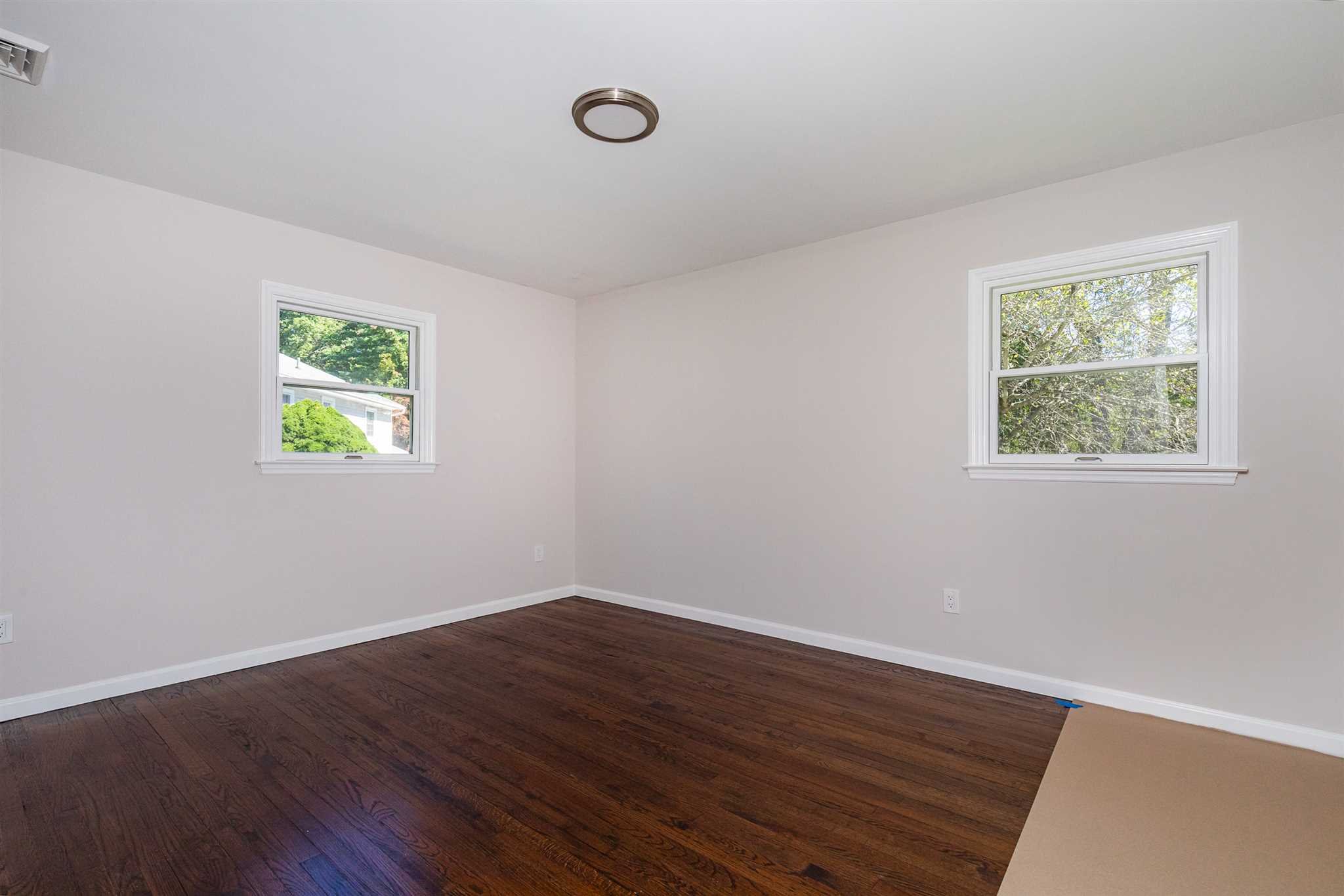9 Manor Way Poughkeepsie, NY 12603 - Photo 9 of 23 a view of room with window and wooden floor