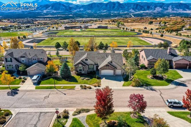 13968 Windy Oaks Road Colorado Springs, CO 80921 - Photo 1 of 34 an aerial view of a house with a yard