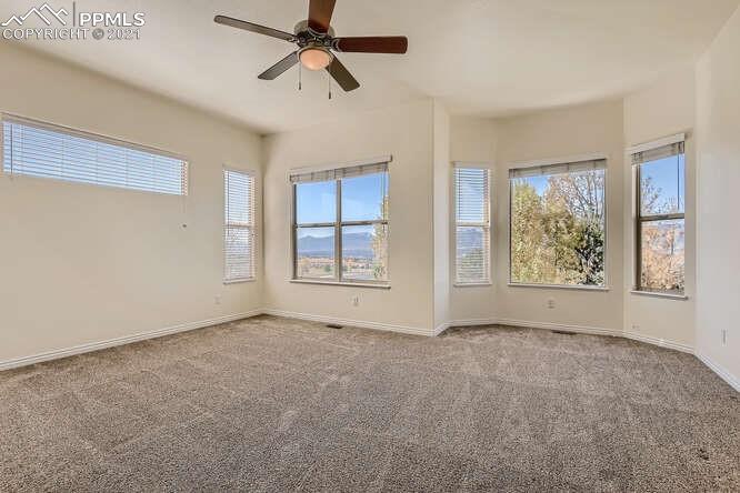 13968 Windy Oaks Road Colorado Springs, CO 80921 - Photo 17 of 34 a view of an empty room with a window