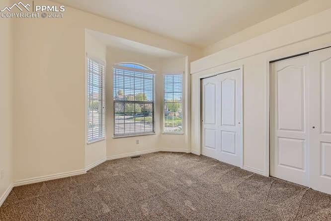 13968 Windy Oaks Road Colorado Springs, CO 80921 - Photo 20 of 34 a view of an empty room with a window