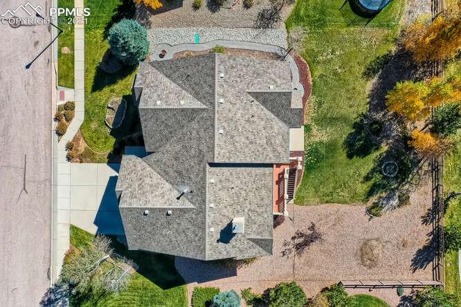 13968 Windy Oaks Road Colorado Springs, CO 80921 - Photo 30 of 34 an aerial view of a house with yard