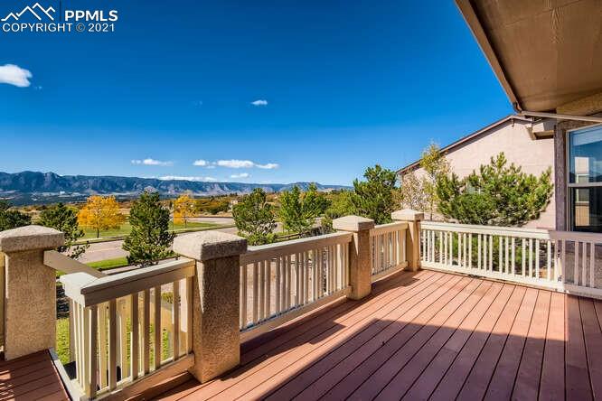13968 Windy Oaks Road Colorado Springs, CO 80921 - Photo 31 of 34 a view of a deck with wooden floor and fence