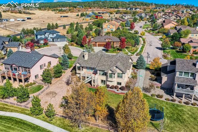 13968 Windy Oaks Road Colorado Springs, CO 80921 - Photo 5 of 34 an aerial view of residential houses with outdoor space