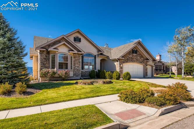13968 Windy Oaks Road Colorado Springs, CO 80921 - Photo 7 of 34 a front view of a house with a yard