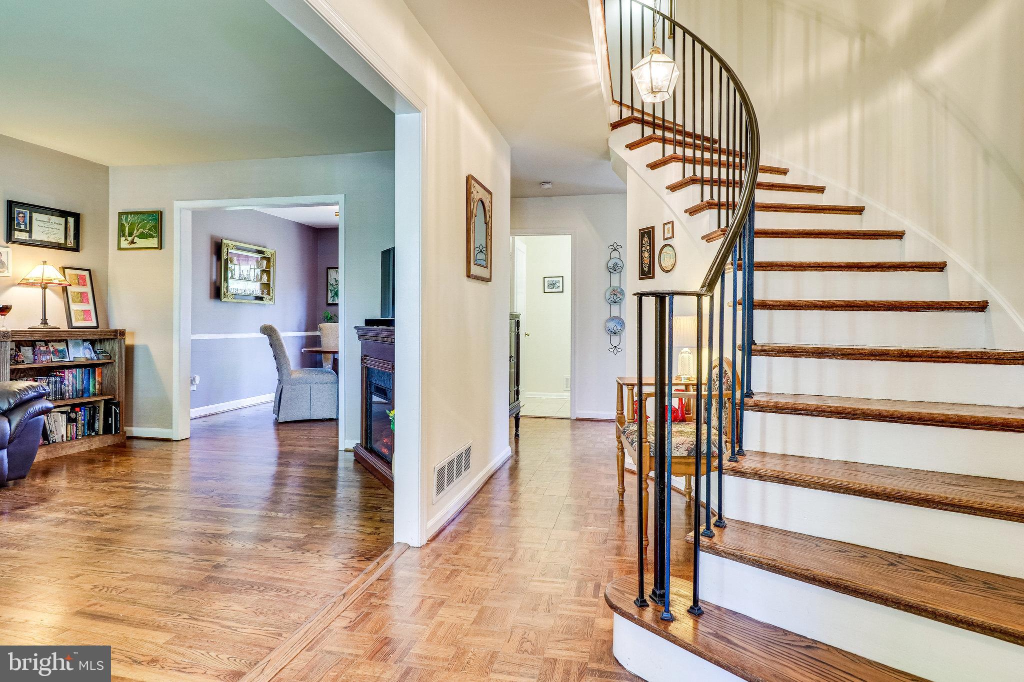 8304 Wickham Road Springfield, VA 22152 - Photo 5 of 60 Curved Staircase to Upper Level