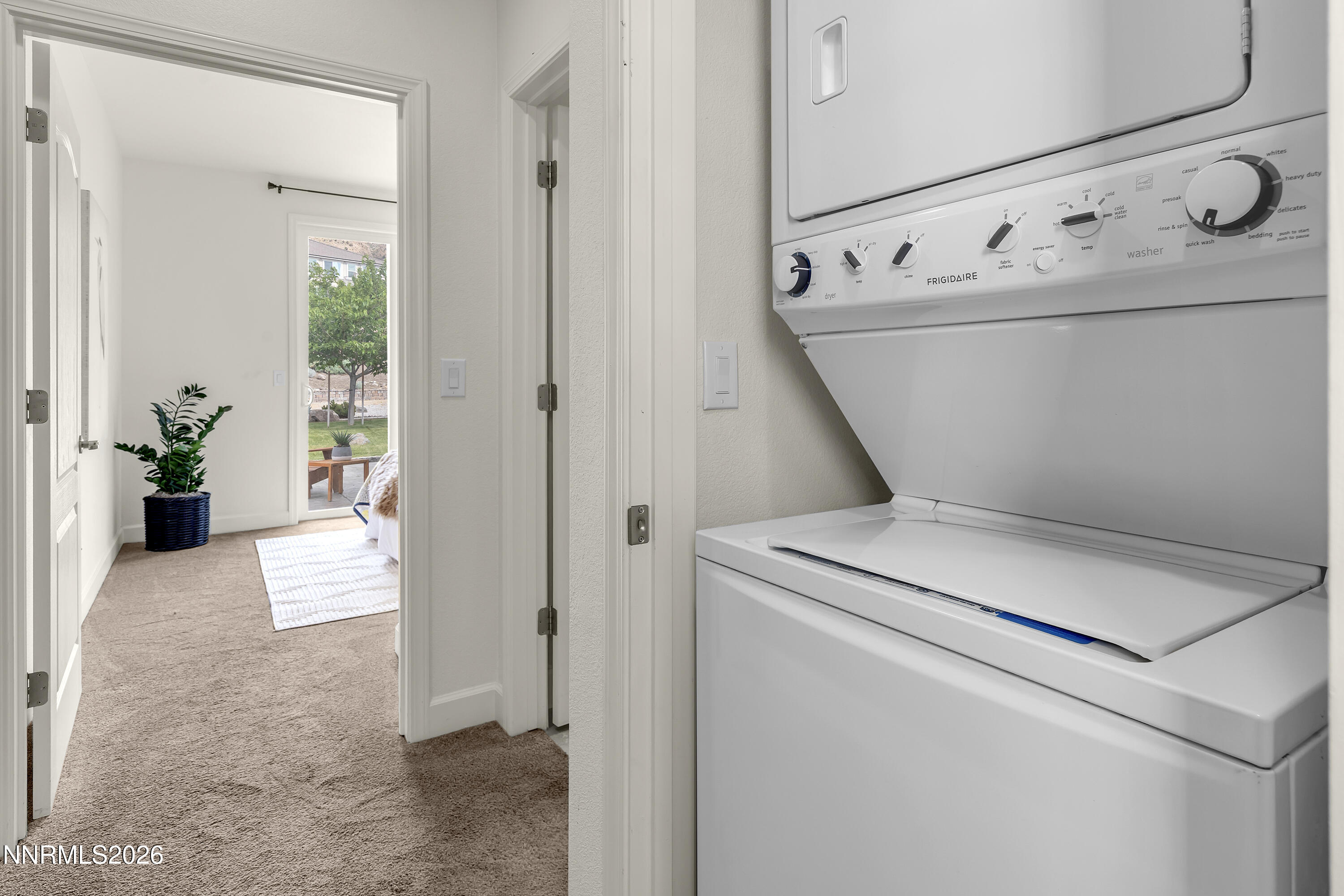 10150 Barrel Racer Drive Reno, NV 89521 - Photo 33 of 64 a view of washer and dryer with bathroom in the background