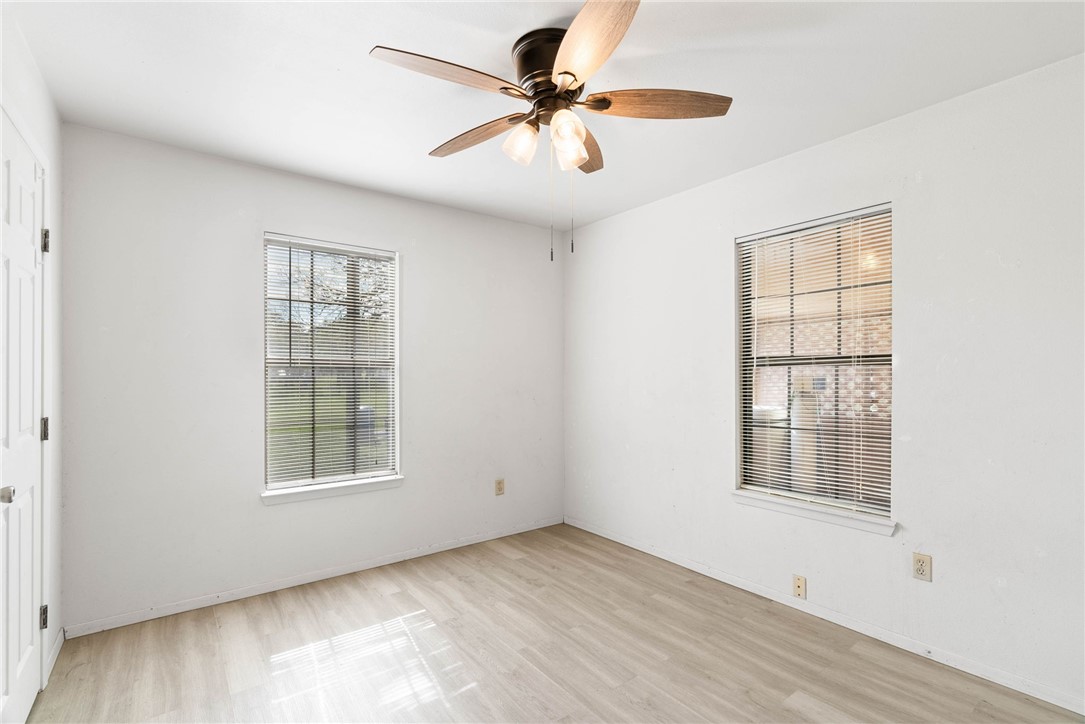 9616 Pvt Huisache Ranch Sinton, TX 78387 - Photo 12 of 21 an empty room with windows and ceiling fan