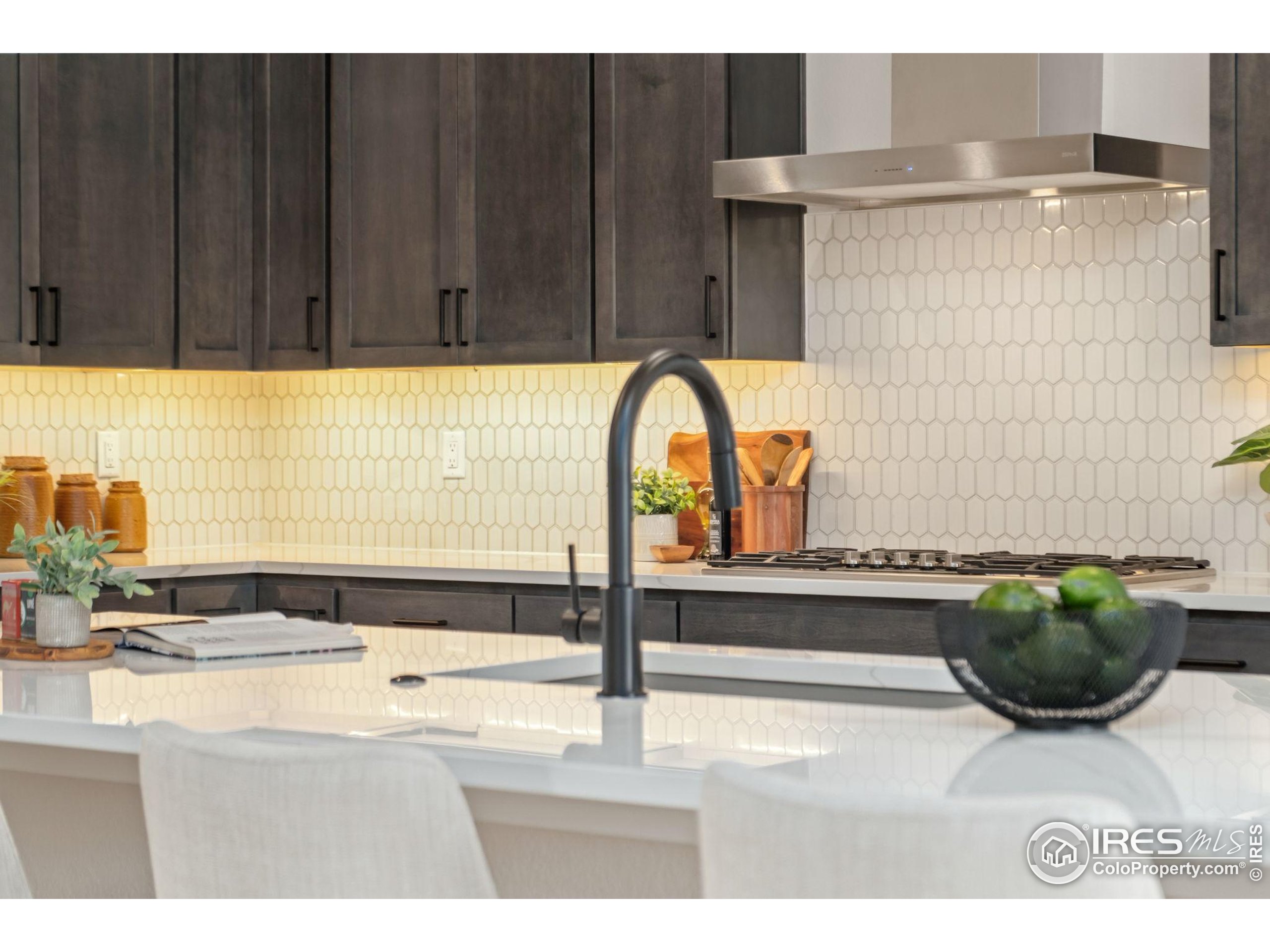 1729 Beachside Drive Windsor, CO 80550 - Photo 13 of 49 a picture of a sink and a microwave