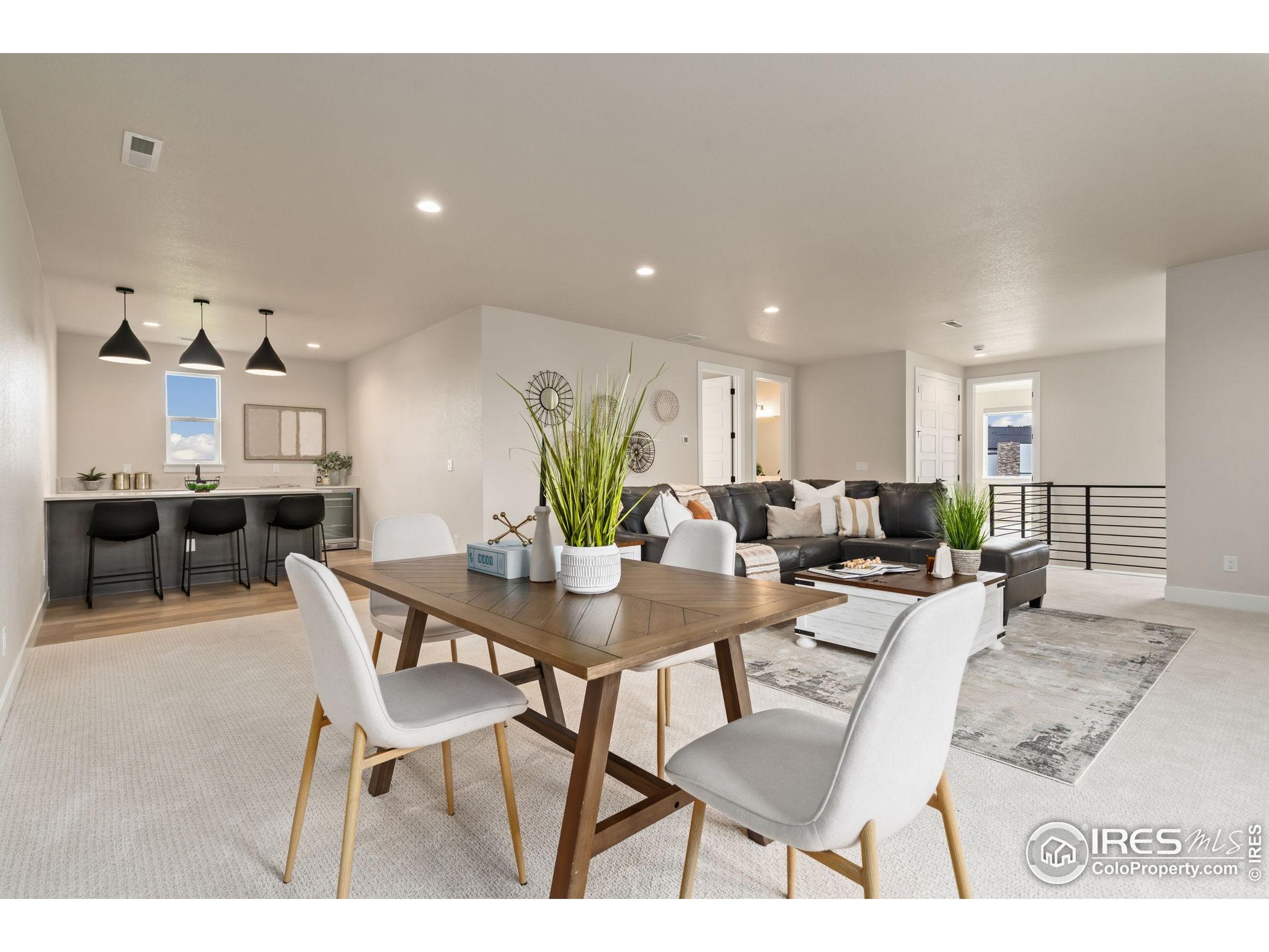 1729 Beachside Drive Windsor, CO 80550 - Photo 27 of 49 a view of a dining room with furniture