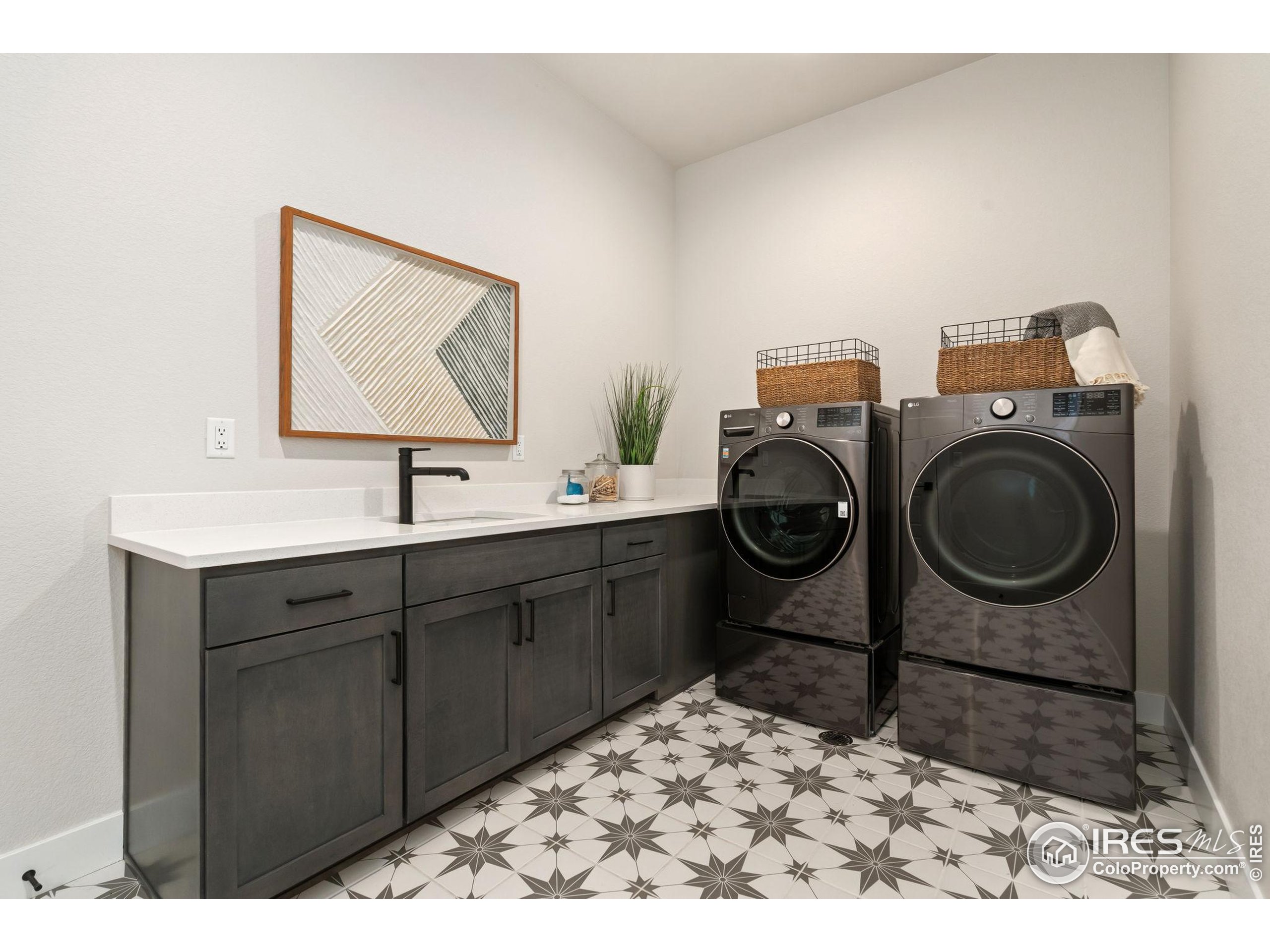 1729 Beachside Drive Windsor, CO 80550 - Photo 33 of 49 a bathroom with a sink a vanity and utility