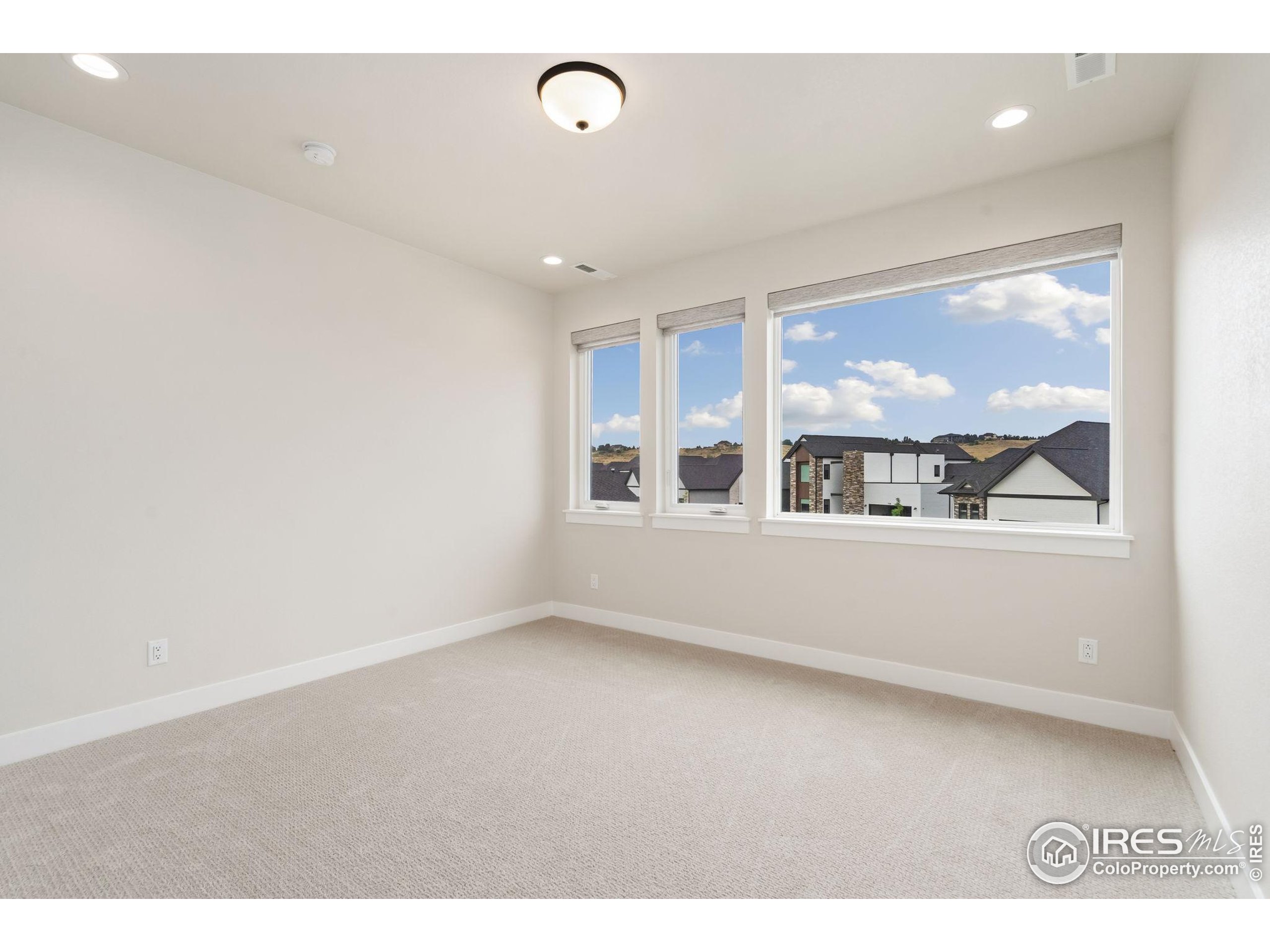 1729 Beachside Drive Windsor, CO 80550 - Photo 37 of 49 a view of an empty room with a window
