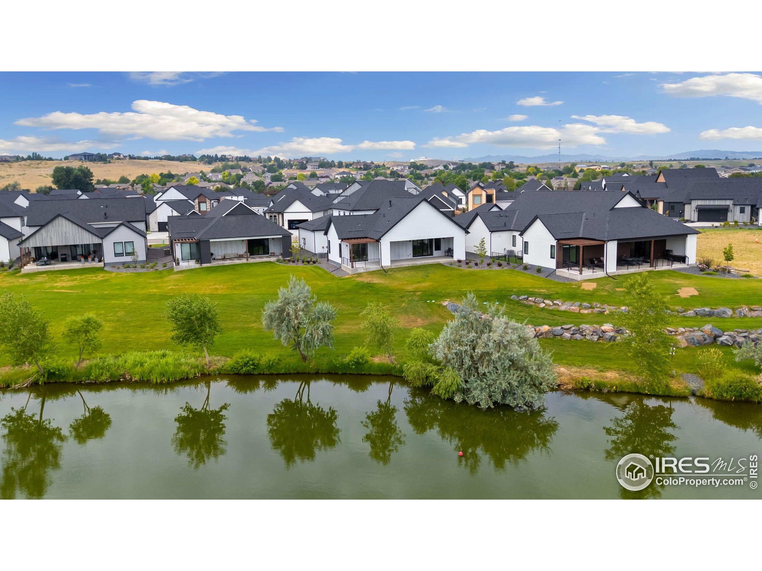 1729 Beachside Drive Windsor, CO 80550 - Photo 47 of 49 a outdoor view with a lake view