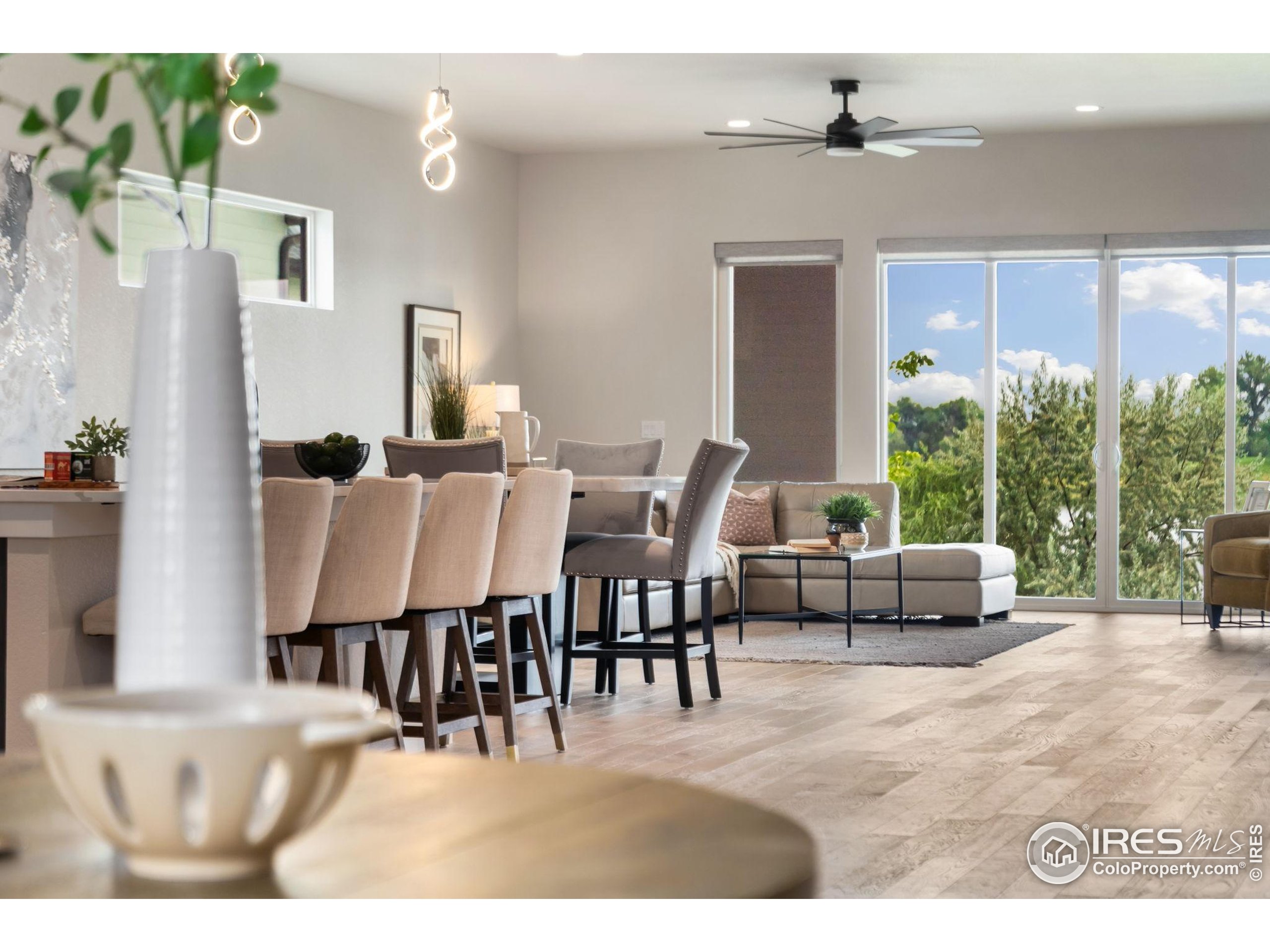 1729 Beachside Drive Windsor, CO 80550 - Photo 6 of 49 a living room with furniture and a large window
