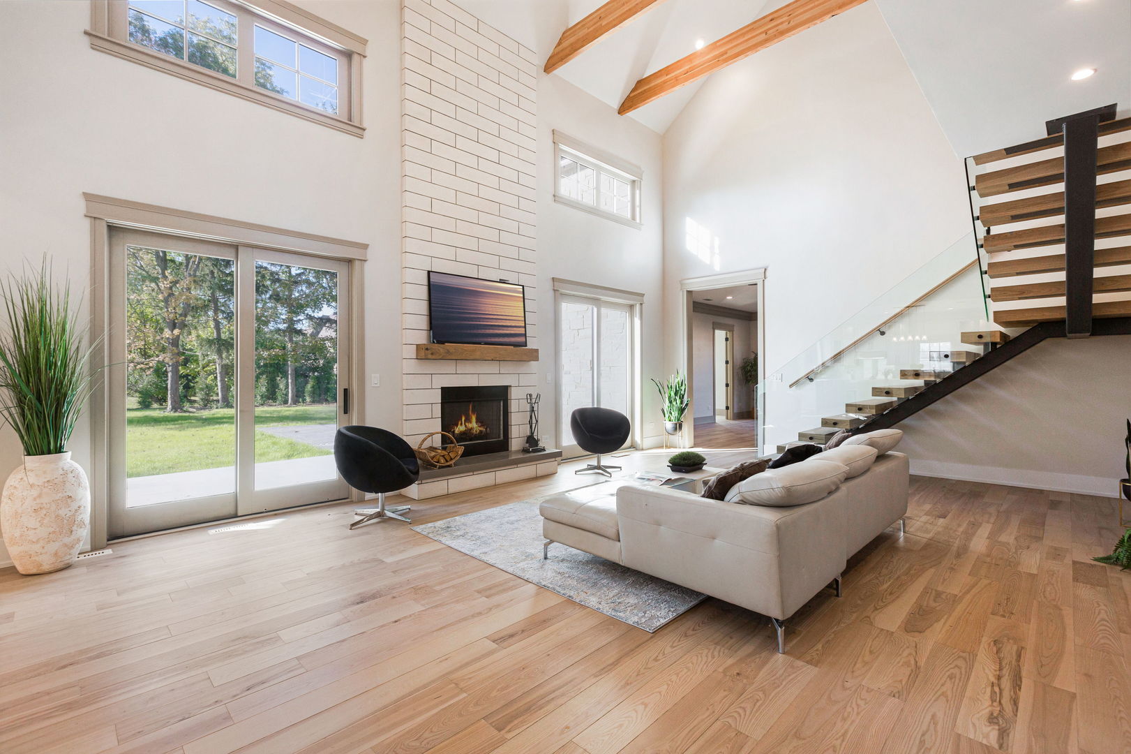 1921 Beechnut Road Northbrook, IL 60062 - Photo 11 of 56 a living room with furniture a fireplace a flat screen tv and a large window