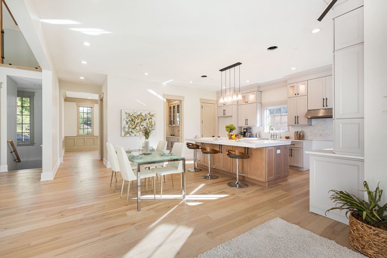 1921 Beechnut Road Northbrook, IL 60062 - Photo 20 of 56 a living room with kitchen island furniture and a kitchen view with wooden floor