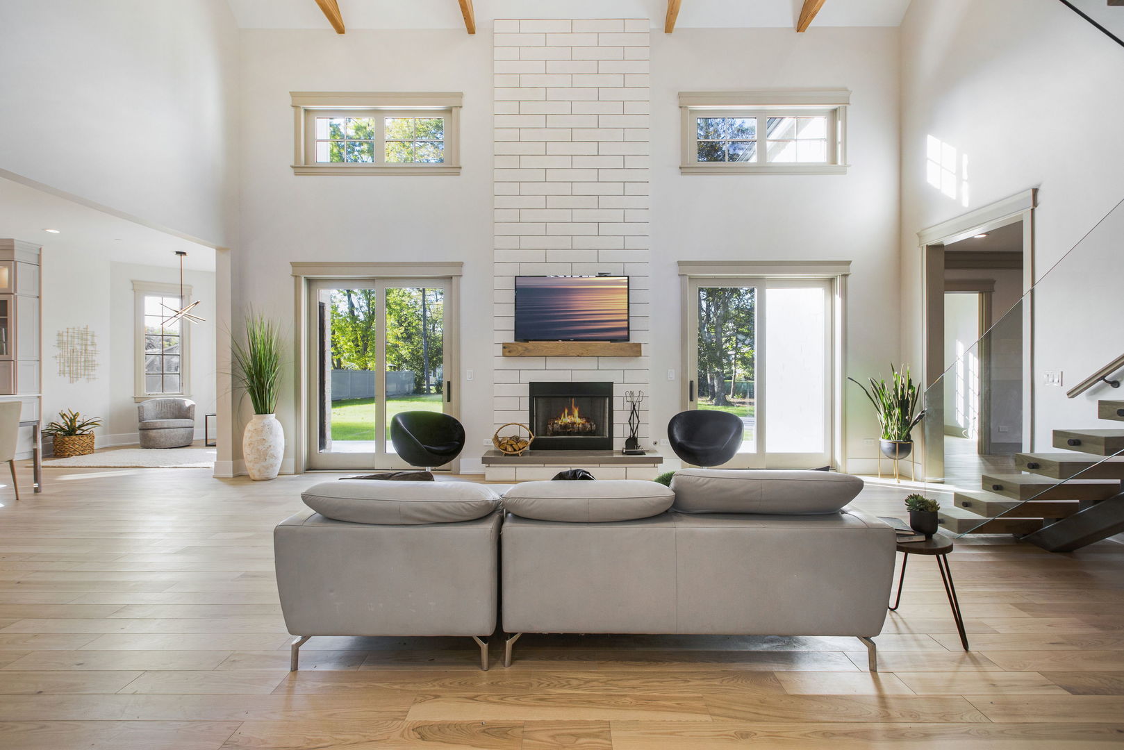 1921 Beechnut Road Northbrook, IL 60062 - Photo 6 of 56 a living room with furniture a large window and a fireplace