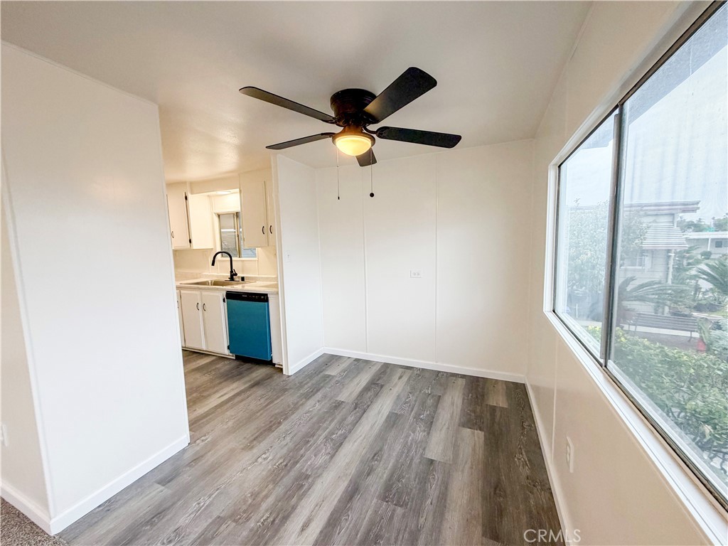 104 Sir Tristram Drive, Unit 104 Riverside, CA 92507 - Photo 12 of 26 a view of workspace with wooden floor and a window