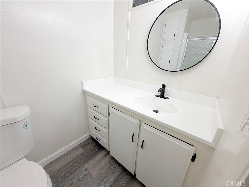 104 Sir Tristram Drive, Unit 104 Riverside, CA 92507 - Photo 16 of 26 a bathroom with a sink and a mirror