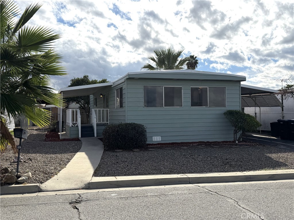 104 Sir Tristram Drive, Unit 104 Riverside, CA 92507 - Photo 2 of 26 a front view of a house with garage