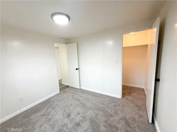 an empty room with a empty space and a window