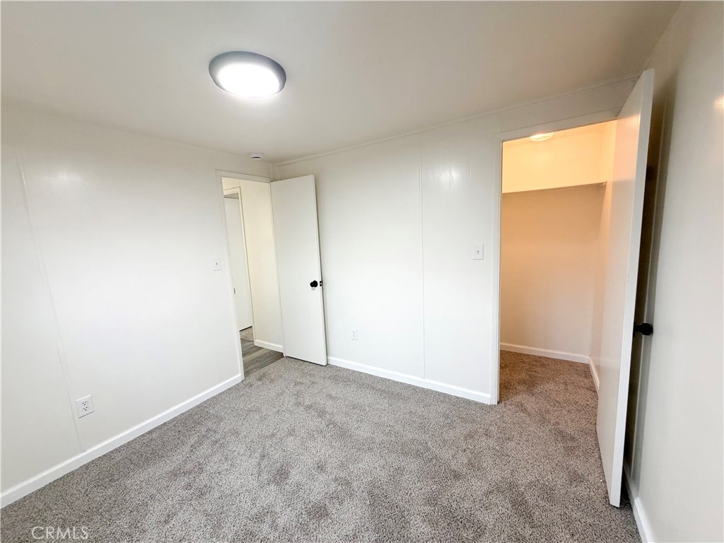 104 Sir Tristram Drive, Unit 104 Riverside, CA 92507 - Photo 21 of 26 an empty room with a empty space and a window