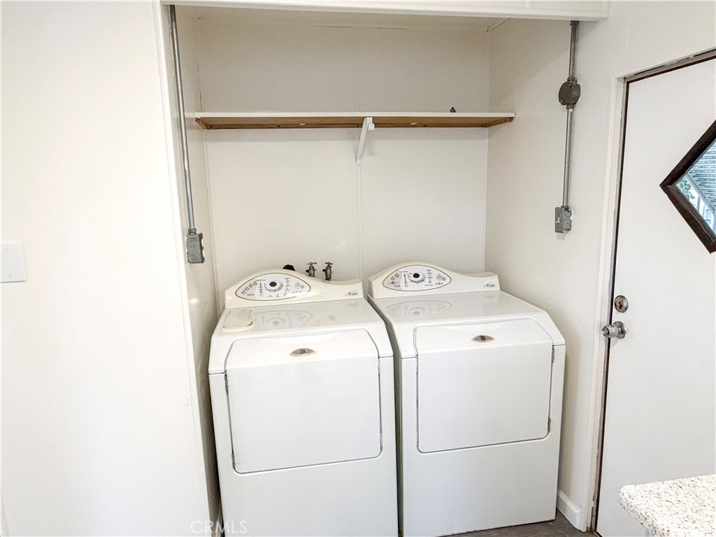 104 Sir Tristram Drive, Unit 104 Riverside, CA 92507 - Photo 24 of 26 Laundry Area Includes Full-Size Washer and Dryer