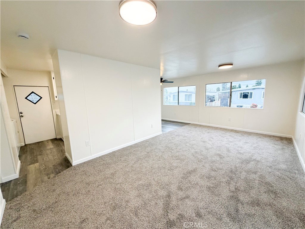 104 Sir Tristram Drive, Unit 104 Riverside, CA 92507 - Photo 9 of 26 a view of a livingroom with a staircase