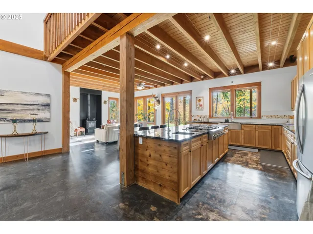 a open kitchen with cabinets and wooden floor