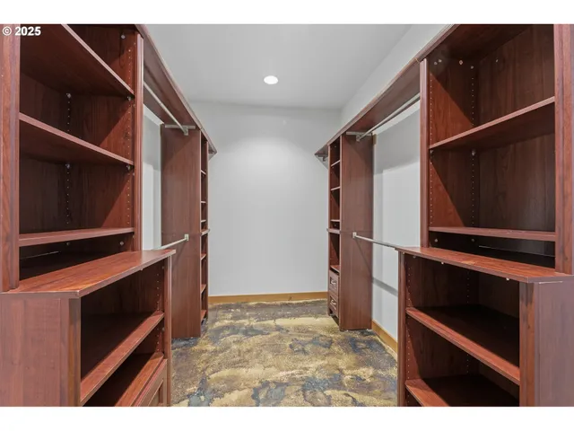 a view of kitchen with cabinets and steel appliances