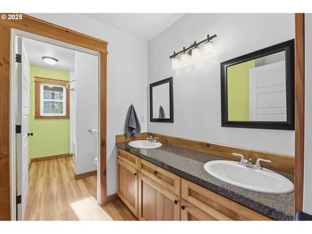 a bathroom with a granite countertop sink a mirror and a