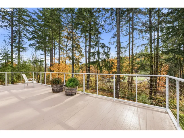 a view of a balcony with yard