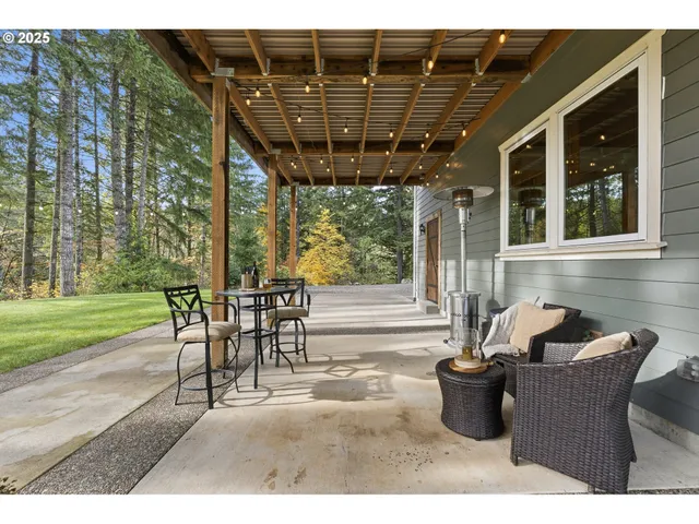 a view of a porch with furniture and yard