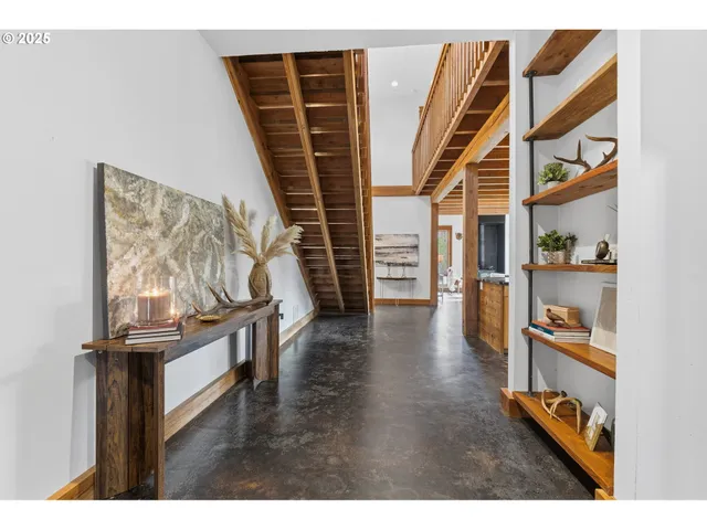 a view of an entryway with wooden floor