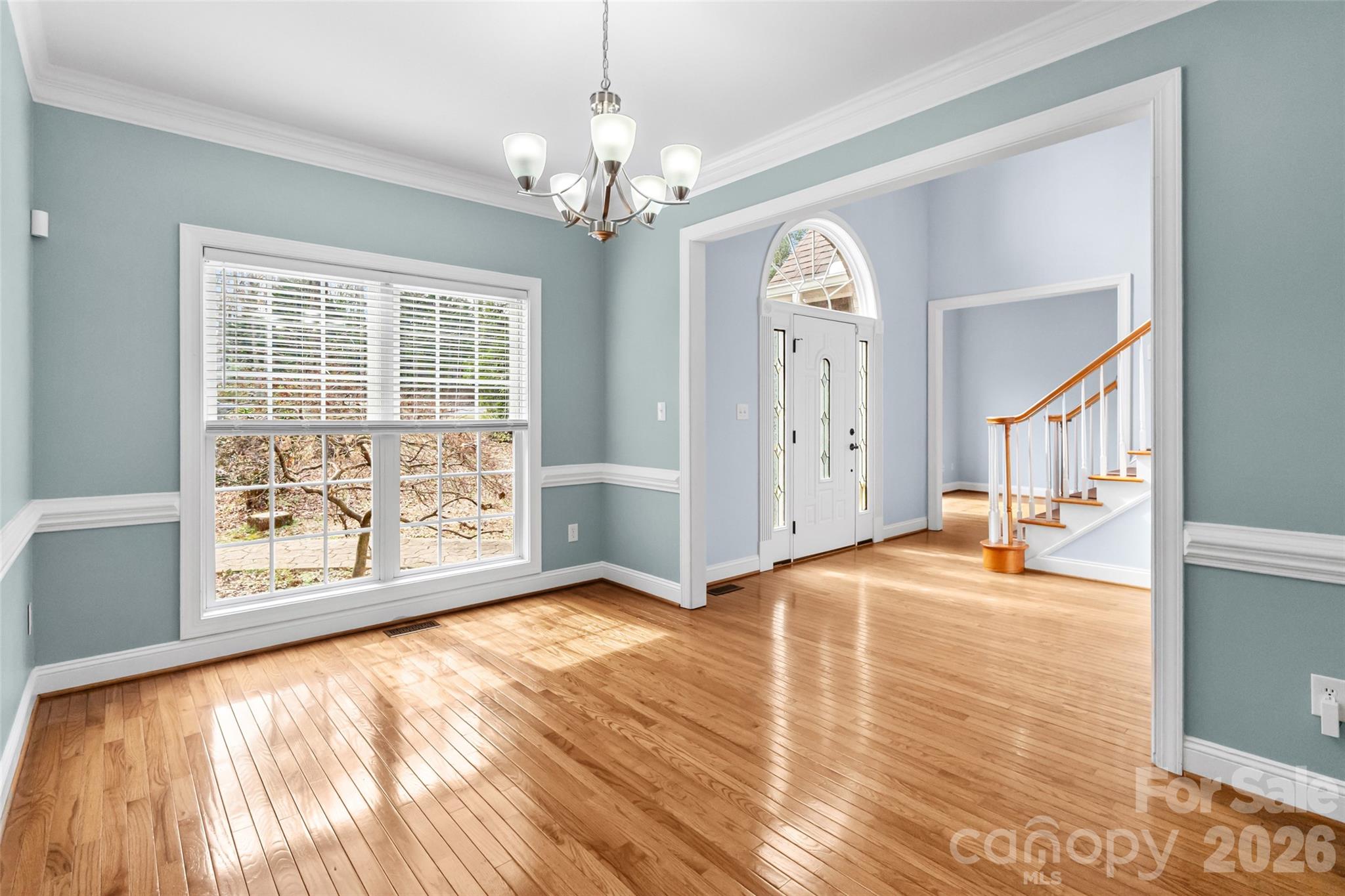 321 Forbes Court Clover, SC 29710 - Photo 11 of 31 a view of a livingroom with wooden floor and a ceiling fan