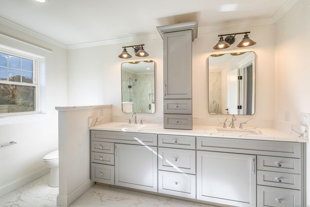 a bathroom with a bathtub and shower