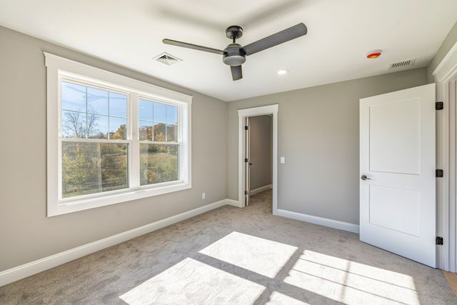 a bathroom with double vanity sinks and a mirror