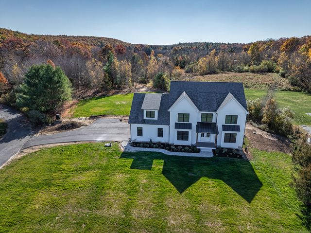 a aerial view of a house with swimming pool