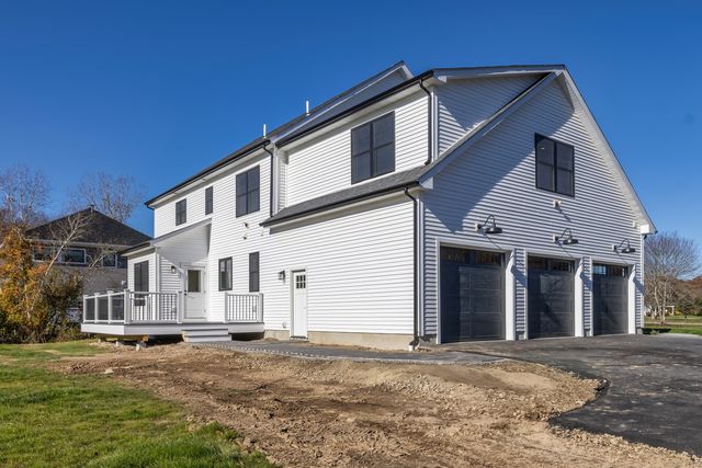 a view of a wooden deck with a yard