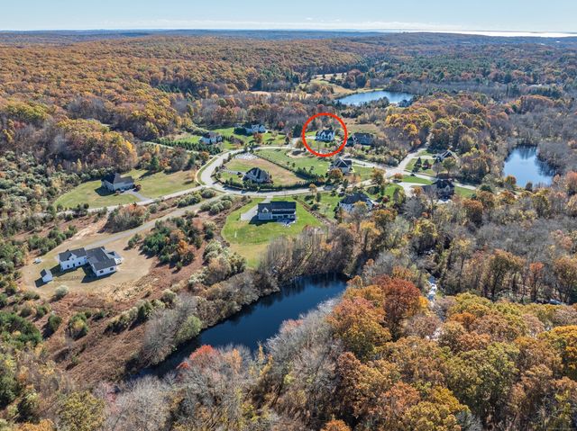 an aerial view of a house with a garden