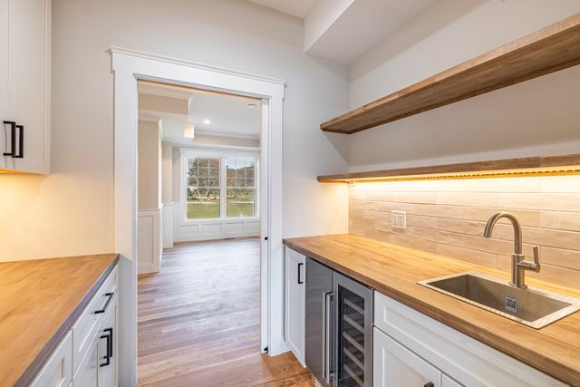 a kitchen with a sink and a window