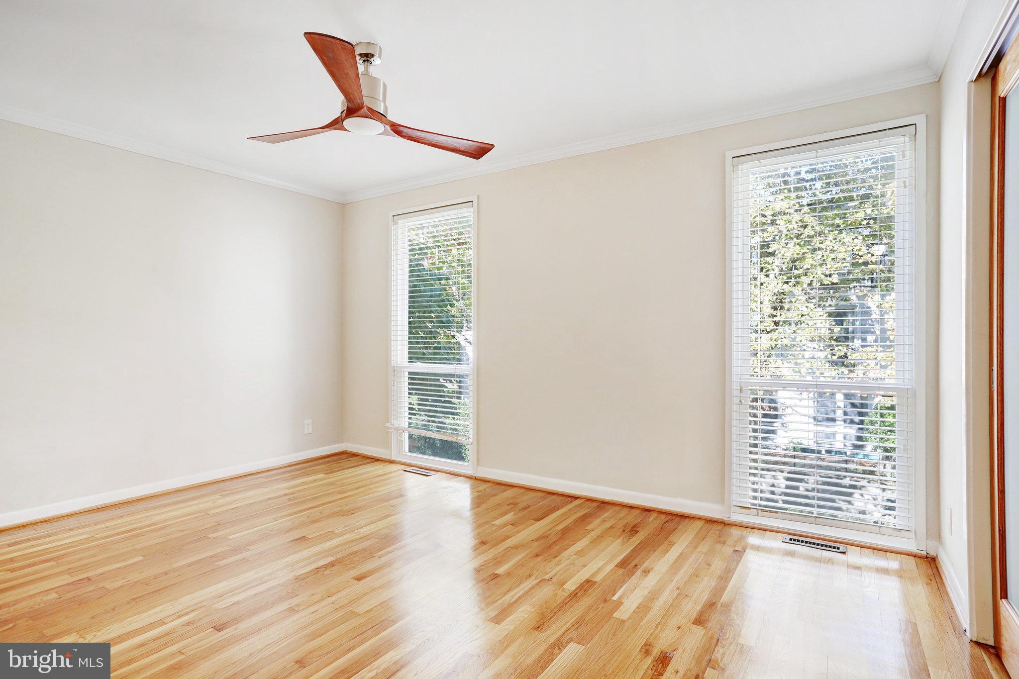 42 G Street Southwest Washington, DC 20024 - Photo 16 of 54 a view of an empty room with wooden floor and a window