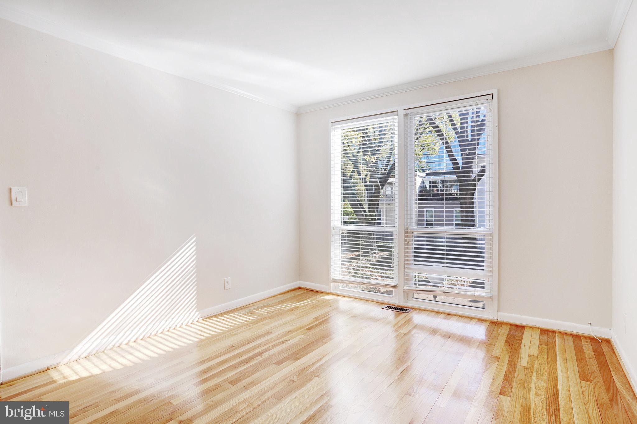 42 G Street Southwest Washington, DC 20024 - Photo 23 of 54 a view of a room with wooden floor and windows