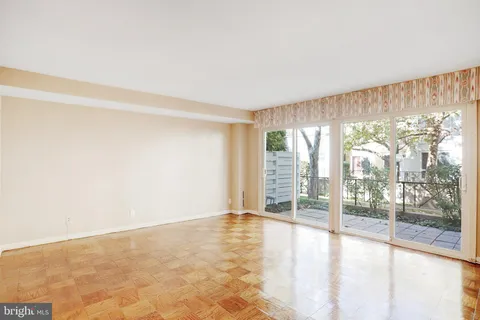 a view of a two chairs and table in the balcony