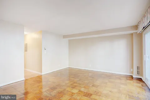 a bathroom with a sink a toilet and shower curtain