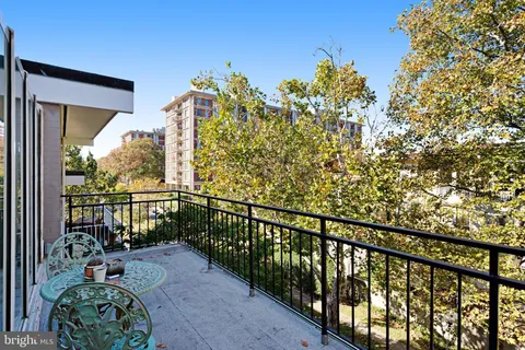 a view of a balcony with chairs