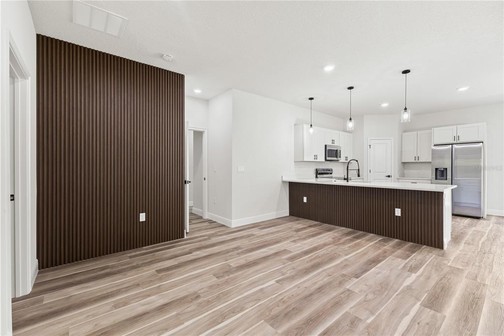 5217 Southwest 165th St Road Ocala, FL 34473 - Photo 13 of 35 a view of kitchen with kitchen island sink and refrigerator