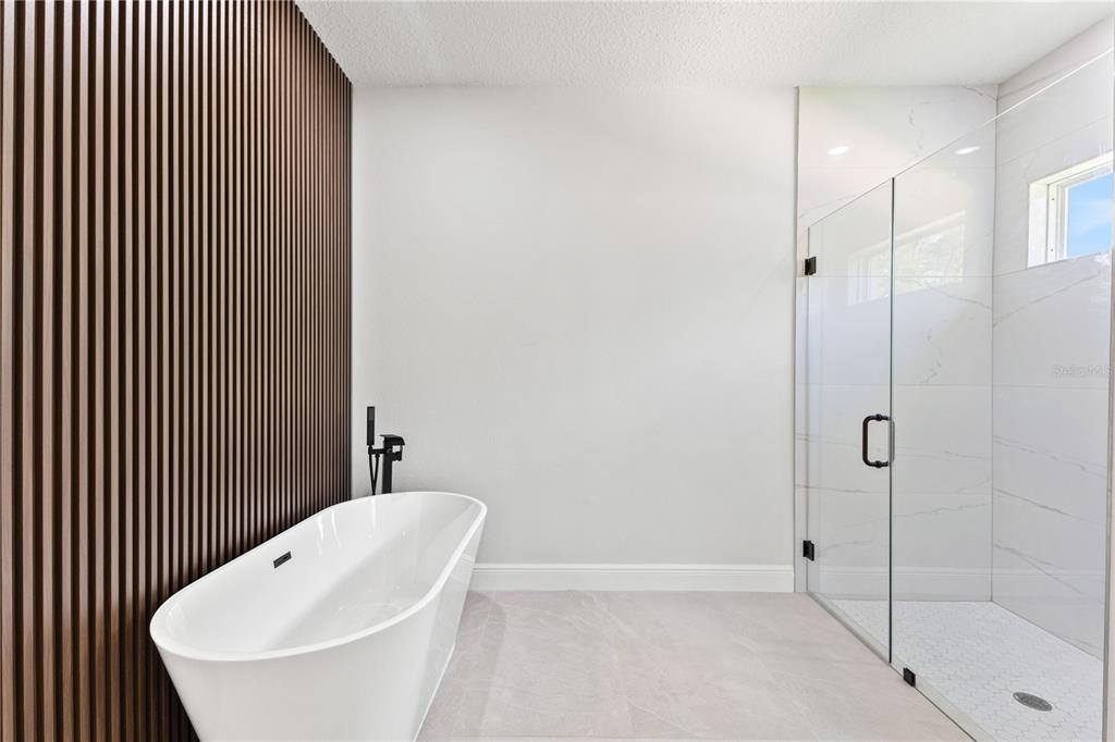 5217 Southwest 165th St Road Ocala, FL 34473 - Photo 23 of 35 a bathroom with a bathtub and shower