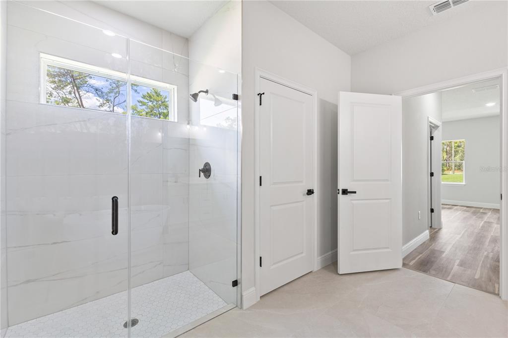 5217 Southwest 165th St Road Ocala, FL 34473 - Photo 24 of 35 a bathroom with a shower