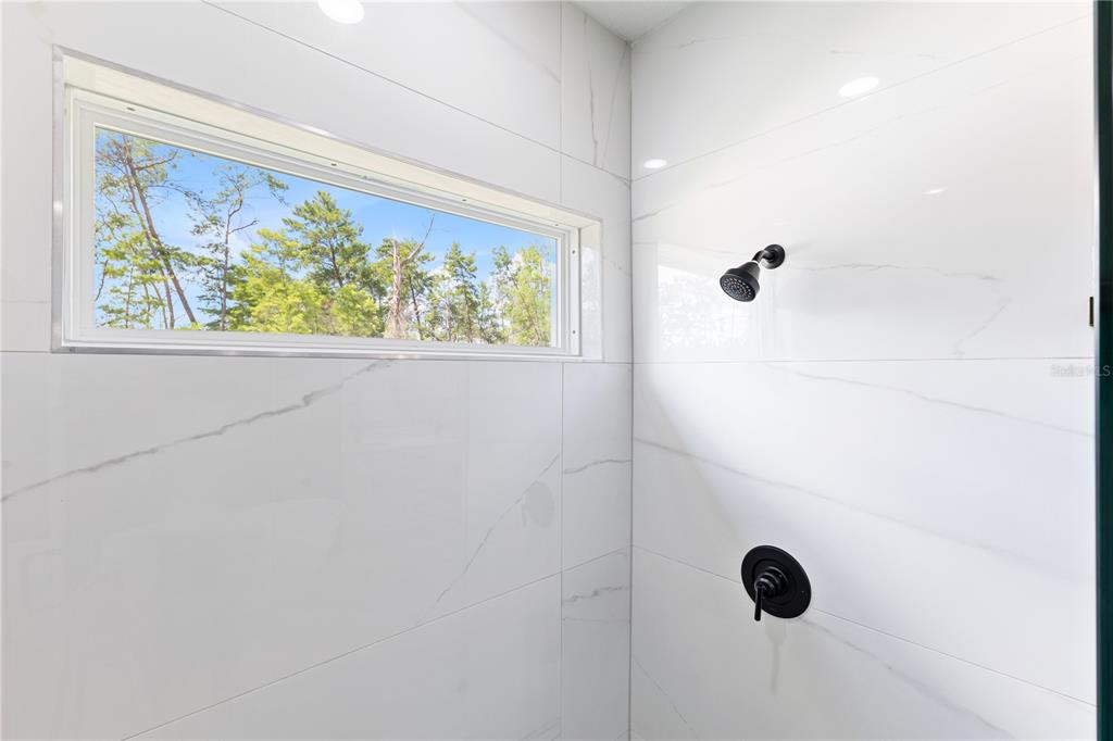 5217 Southwest 165th St Road Ocala, FL 34473 - Photo 25 of 35 a bathroom with a shower