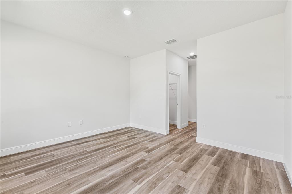 5217 Southwest 165th St Road Ocala, FL 34473 - Photo 30 of 35 a view of room with walk in closet